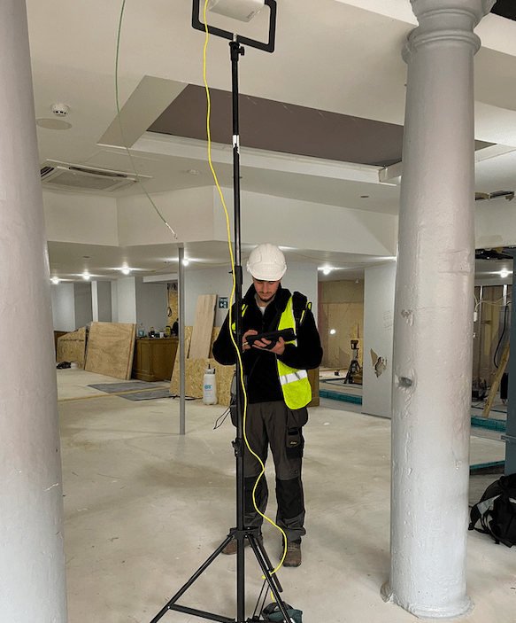 the purpose of this image is to show our customers one of our engineers performing a Wi-Fi Site Survey.