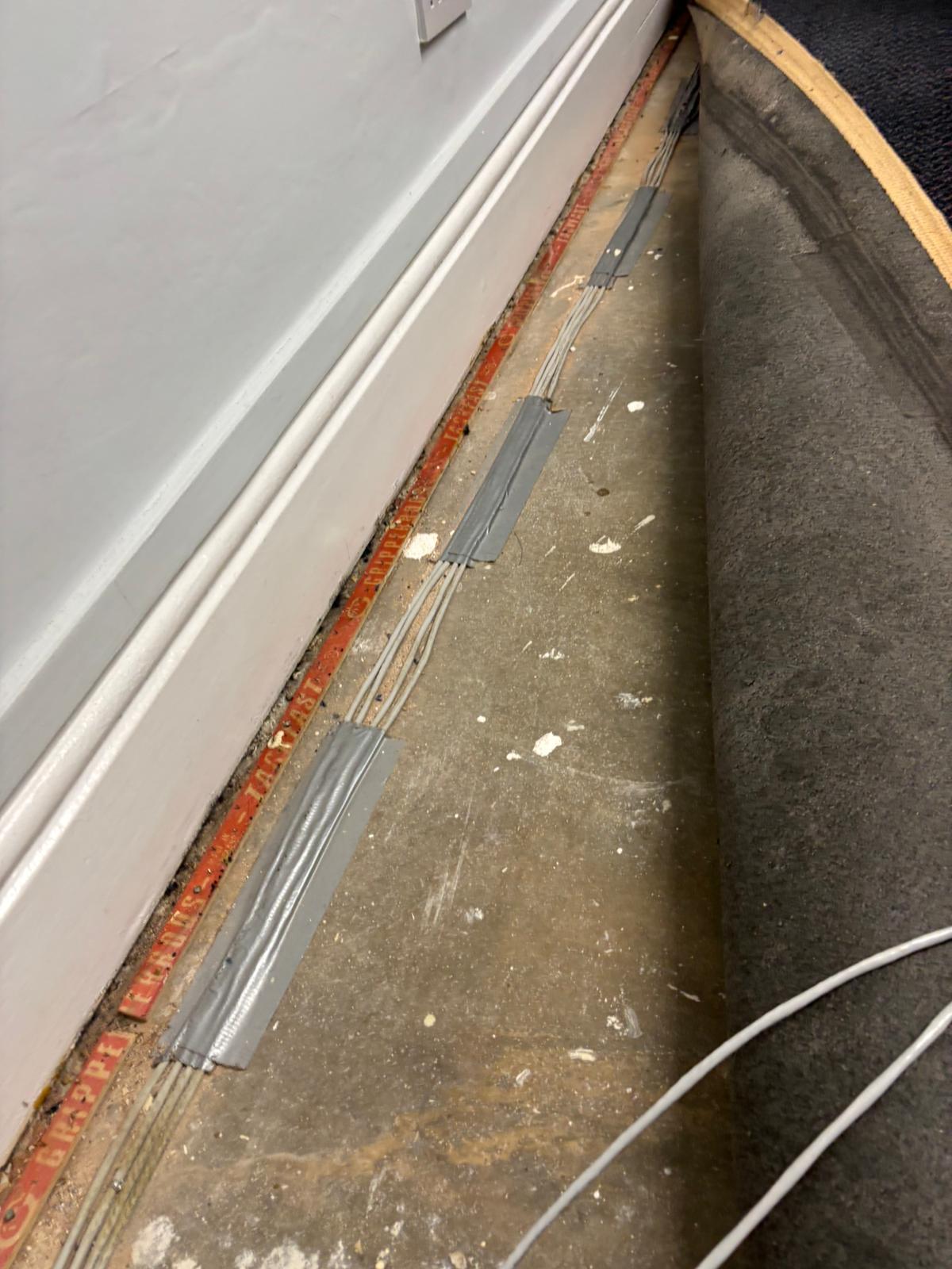 Dangerous PVC cabling under carpet