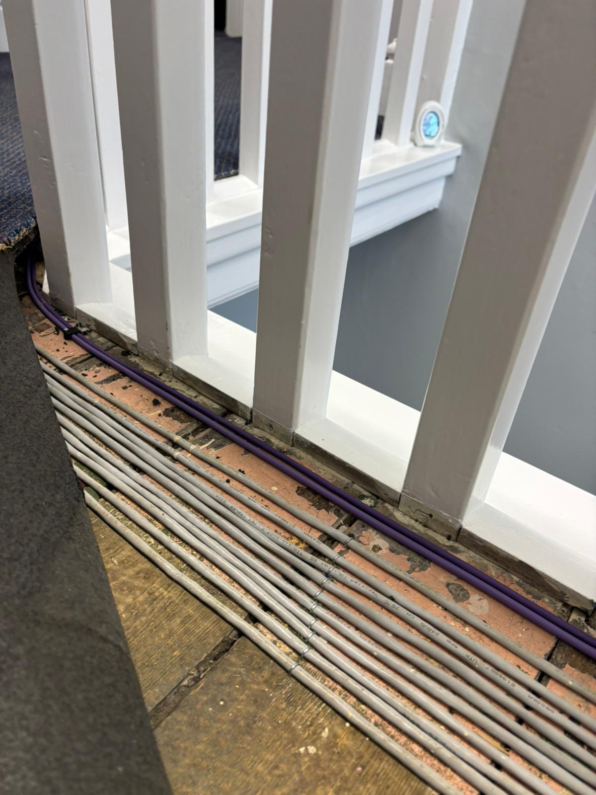 Dangerous PVC cabling under carpet